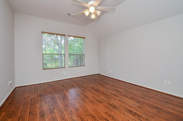 empty room featuring visible vents, baseboards, lofted ceiling, wood-type flooring, and ceiling fan