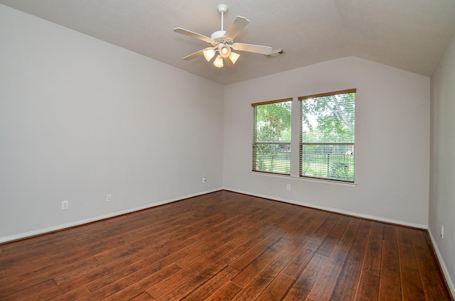 unfurnished room featuring ceiling fan, lofted ceiling, visible vents, baseboards, and dark wood-style floors