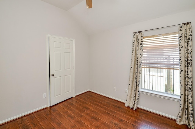 spare room with vaulted ceiling, ceiling fan, hardwood / wood-style floors, and baseboards