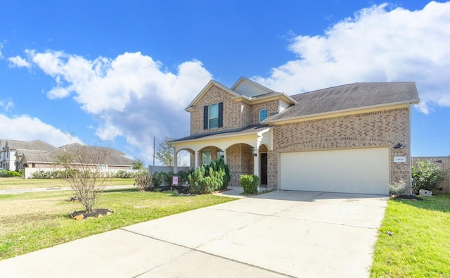 view of front of home featuring driveway, a garage, a front lawn, and brick siding