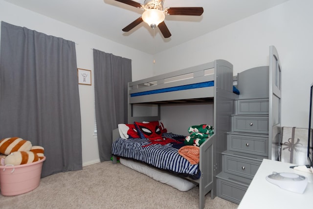 bedroom with light carpet and a ceiling fan