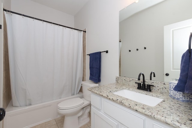 full bath featuring toilet, tile patterned flooring, shower / bath combo, and vanity