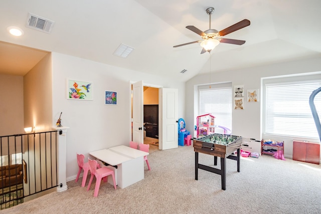 playroom featuring a ceiling fan, lofted ceiling, visible vents, and carpet flooring