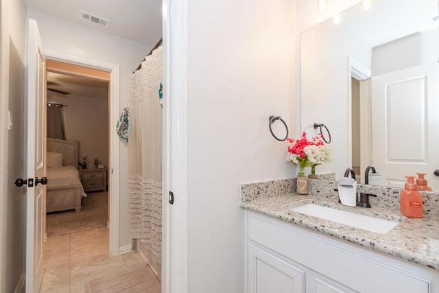 full bathroom featuring visible vents and vanity