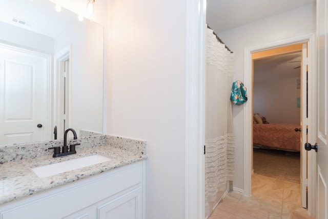 full bath with vanity and visible vents