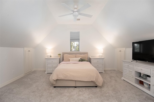 bedroom featuring lofted ceiling, baseboards, a ceiling fan, and light colored carpet