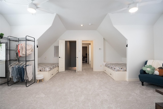 bonus room featuring lofted ceiling, ceiling fan, visible vents, and light colored carpet