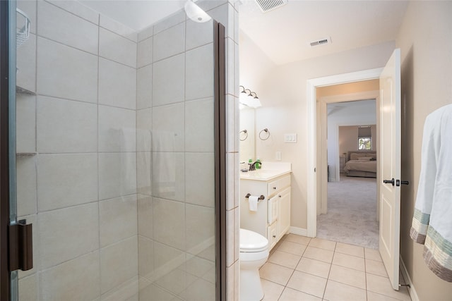 bathroom with a stall shower, visible vents, vanity, and tile patterned floors