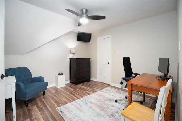 home office with a ceiling fan, baseboards, and wood finished floors