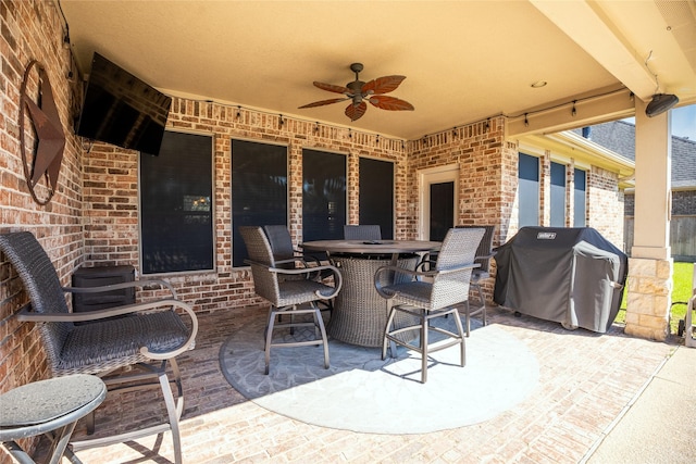 view of patio / terrace featuring ceiling fan, outdoor dining area, and grilling area