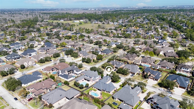 birds eye view of property with a residential view