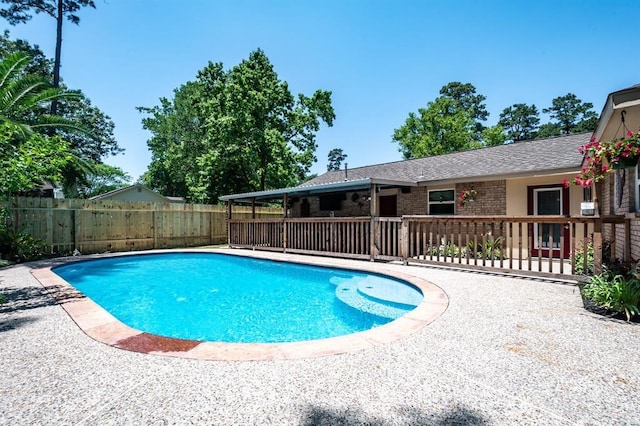 view of swimming pool featuring a fenced in pool, fence, and a patio