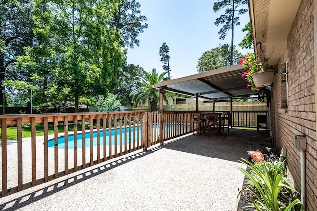 exterior space with a fenced in pool, a patio area, and a fenced backyard