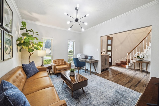 living area featuring hardwood / wood-style floors, stairway, a notable chandelier, and ornamental molding