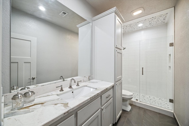 full bath featuring tile patterned flooring, toilet, visible vents, vanity, and a stall shower