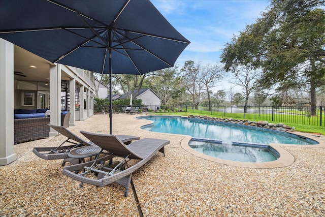 view of pool featuring an in ground hot tub, a fenced backyard, a fenced in pool, and a patio