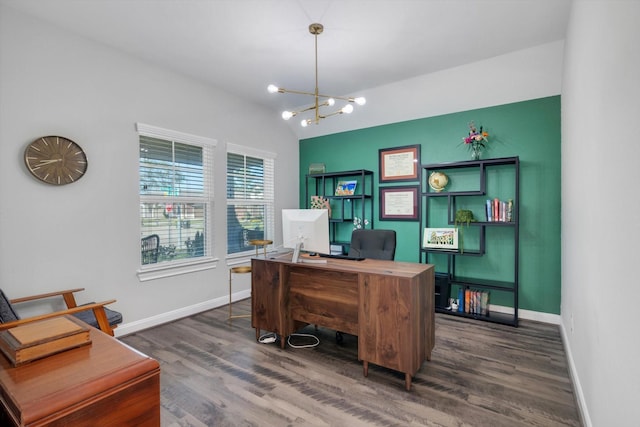 office with dark wood finished floors, an inviting chandelier, baseboards, and vaulted ceiling