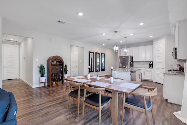 dining room with recessed lighting, visible vents, baseboards, and dark wood-style flooring