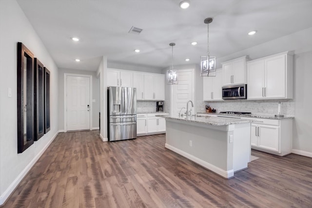 kitchen featuring visible vents, backsplash, dark wood-type flooring, white cabinets, and stainless steel appliances