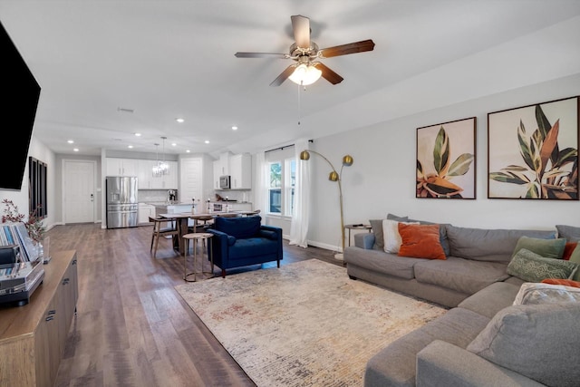 living room featuring baseboards, recessed lighting, dark wood-style flooring, and ceiling fan