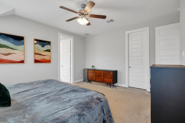 carpeted bedroom featuring visible vents, a ceiling fan, and baseboards