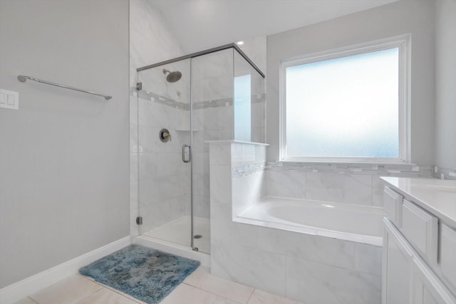 full bathroom featuring a garden tub, a stall shower, and tile patterned floors