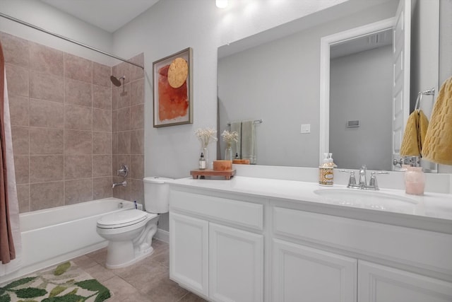 full bath featuring tile patterned floors, shower / bathing tub combination, toilet, and vanity