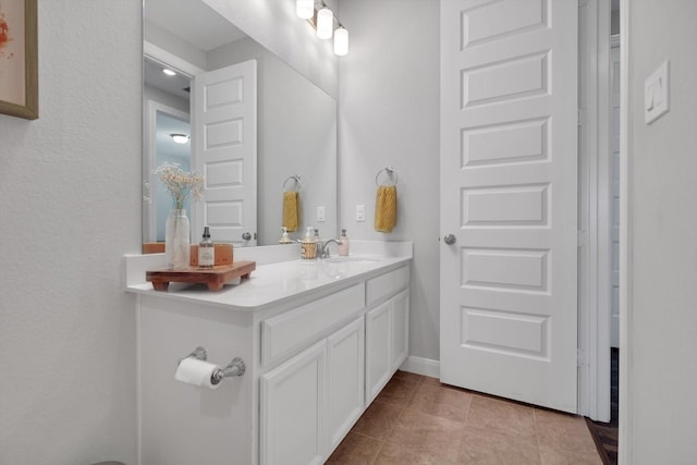 bathroom featuring vanity and tile patterned flooring