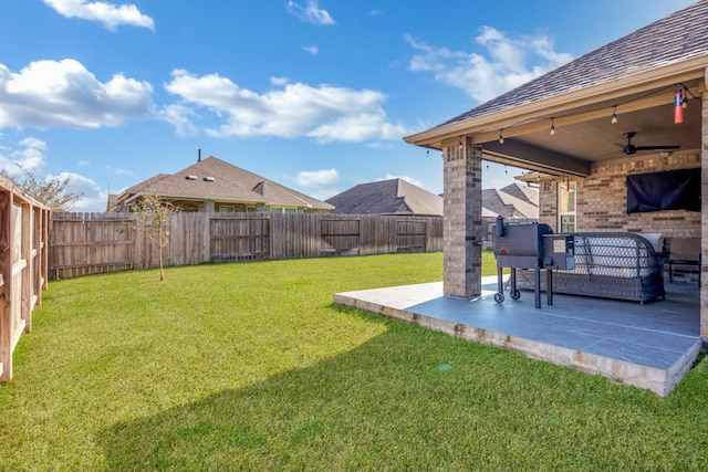 view of yard with a fenced backyard, an outdoor living space, ceiling fan, and a patio