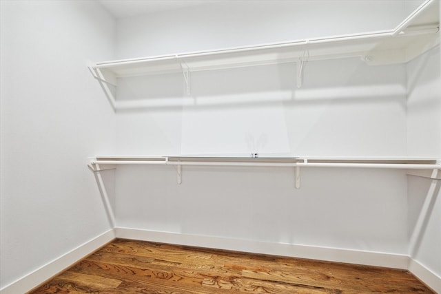 spacious closet with wood finished floors