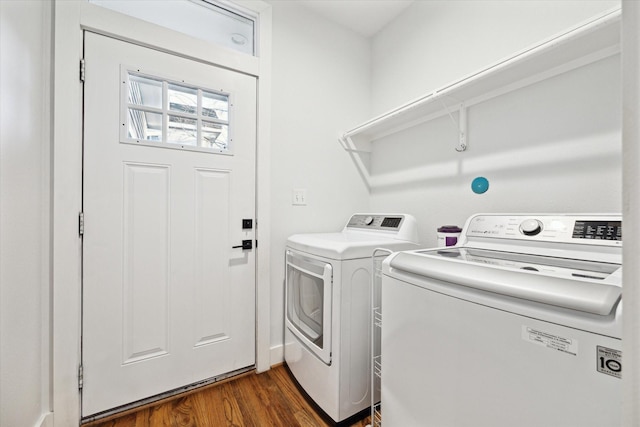 laundry area featuring laundry area, separate washer and dryer, and dark wood-style flooring