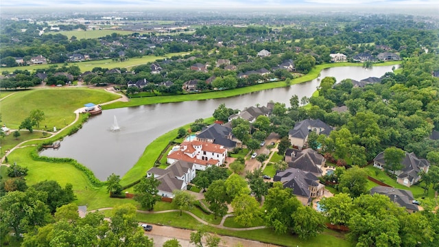 birds eye view of property with a water view and a residential view