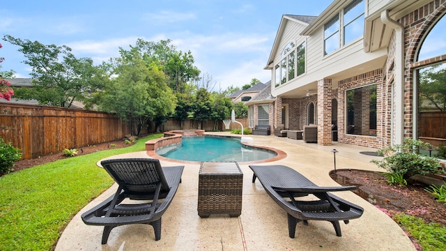 view of pool featuring a hot tub, a fenced backyard, a fenced in pool, and a patio