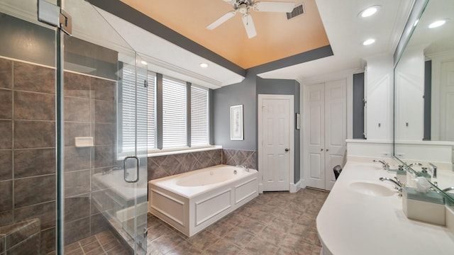 bathroom featuring a sink, visible vents, ornamental molding, a bath, and a stall shower