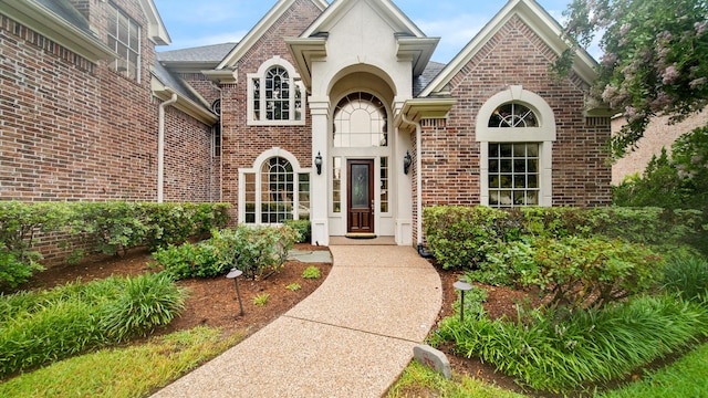 property entrance with brick siding