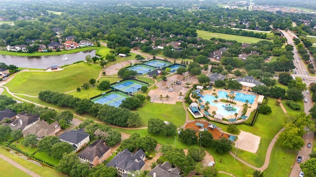 birds eye view of property with a water view and a residential view