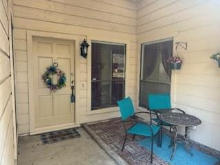 entrance to property featuring a patio