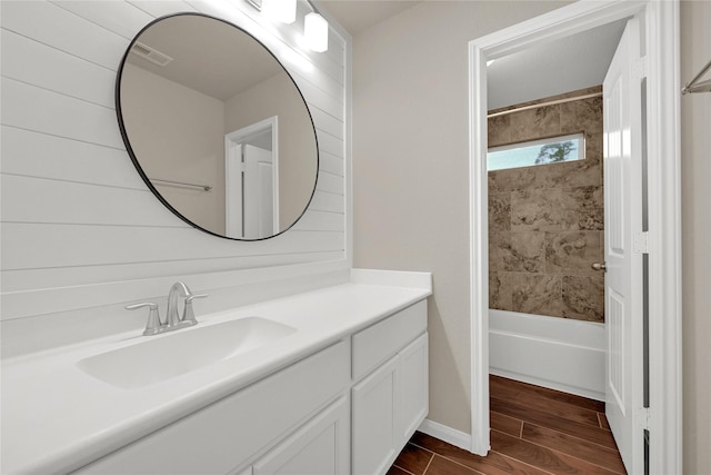 full bathroom with visible vents, bathtub / shower combination, vanity, and wood tiled floor