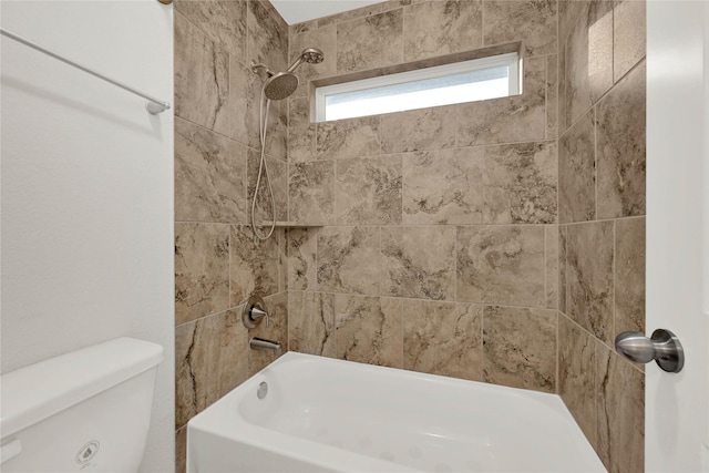 bathroom featuring toilet and  shower combination