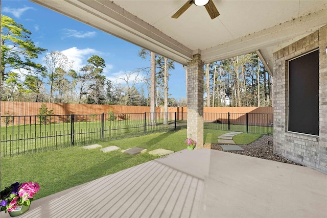 view of patio with a fenced backyard and a ceiling fan