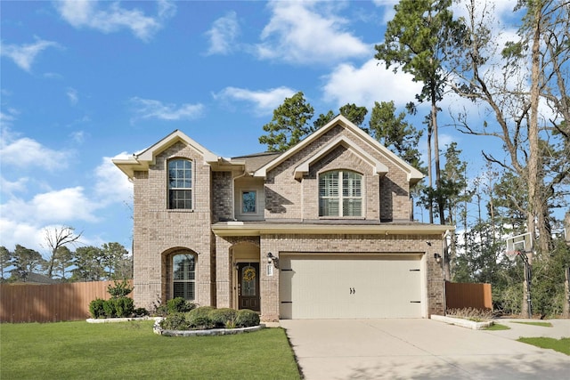 traditional-style home with fence, a front lawn, concrete driveway, and brick siding