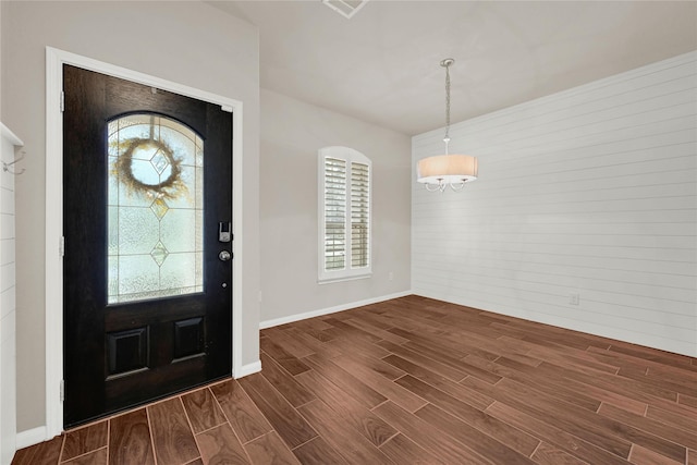 entrance foyer with wood finish floors and baseboards