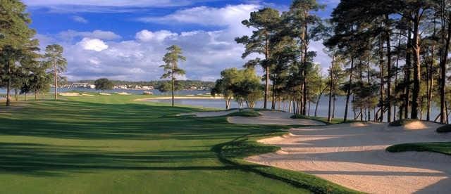 view of home's community with a yard and golf course view