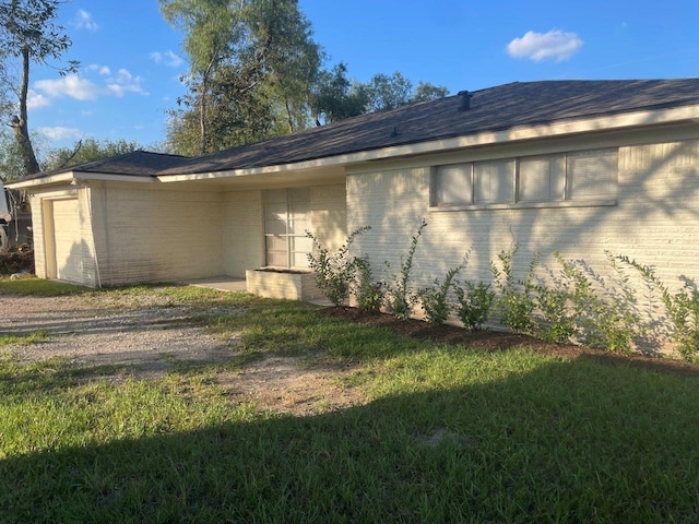 view of home's exterior with brick siding