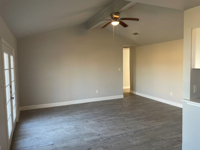 unfurnished room featuring dark wood-style floors, visible vents, lofted ceiling with beams, and baseboards