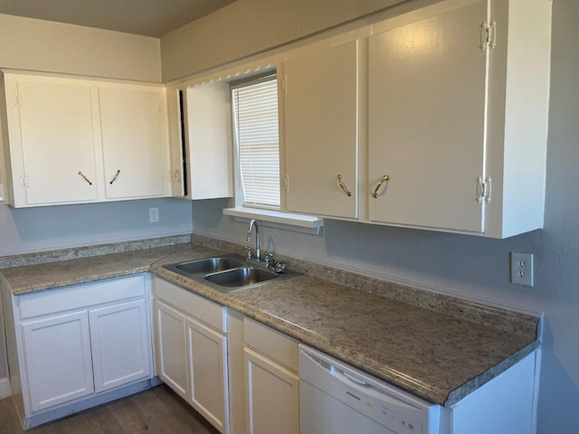 kitchen with dark wood-style floors, white dishwasher, white cabinets, and a sink