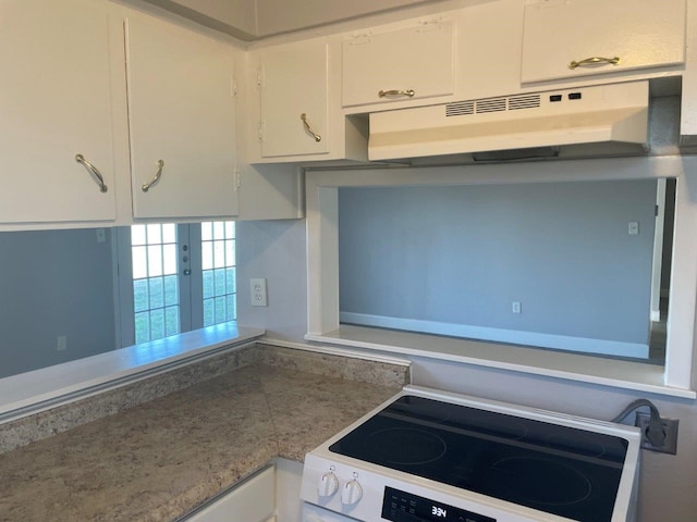 kitchen with under cabinet range hood, white cabinets, white range with electric cooktop, and light countertops