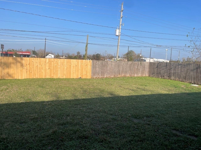 view of yard with fence