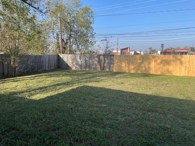 view of yard featuring a fenced backyard