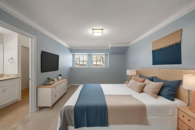 bedroom with ensuite bath, baseboards, and crown molding